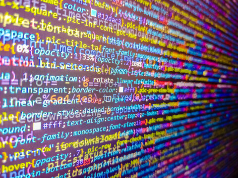 Developer screen with colored website programming code. Abstract background of digital binary code of software. Software developer coding screen. Software developer web program script.