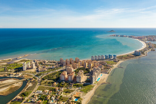 Aerial view of The Sandbar of the Minor Sea, is a seaside spit of Mar Menor in the Region of Murcia, Spain. The strip is 21 km long separating the Mediterranean Sea from the Mar Menor lagoon. Travel