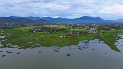 Aerial view of rice field and mountain in countryside of Gorontalo, Indonesia.