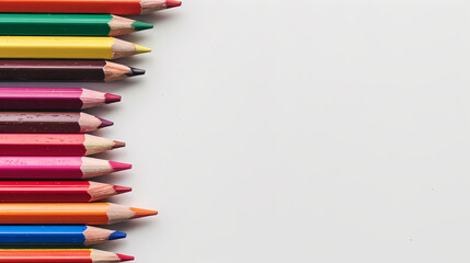 Colorful Pencil Row: A vibrant row of colored pencils arranged against a clean, minimalist backdrop, ready to unleash a burst of creativity. The perfect visual for projects related to art, education.