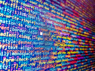 Compressed javascript code on computer screen. Website codes on monitor. Jquery code background. Colorful background knitted closeup. Remote work search. Binr 02. Code on monitor. Wool plaid.