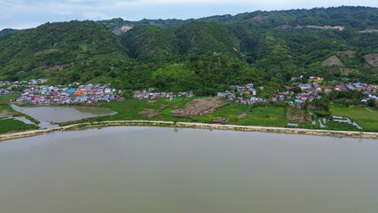 Aerial view of the village and the river in the countryside of Gorontalo, Indonesia