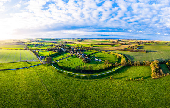 An aerial panoramic shot of Avebury Henge and Stone Circle, Wiltshire, UK