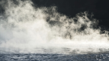 Fototapeta premium Steam rising from water creates mystical atmosphere, enhancing serene beauty of scene. interplay of light and mist adds depth and intrigue to tranquil setting