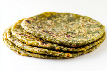 Stack of tortilla isolated on white background, Selective focus green vegetable roti pancake on white