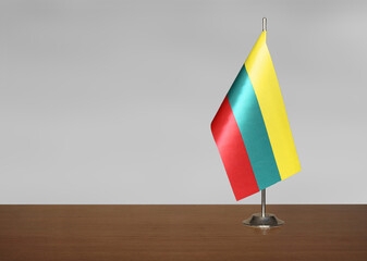 Lithuania table flag on gray blurred background