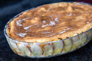 Typical Brazilian apple pie with cloves and cinnamon in fine detail and selective focus