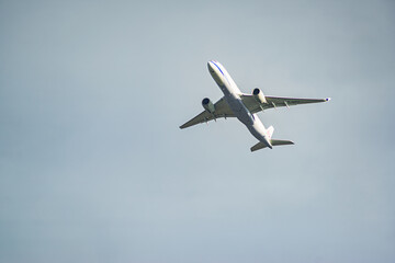 Plane in the sky in the clouds