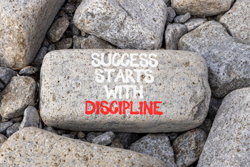 Success starts with discipline symbol. Concept words Success starts with discipline on beautiful grey stone. Beautiful grey stones background Business success starts with discipline concept Copy space