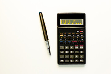 References or reference symbol. Concept word References on beautiful black calculator. Beautiful white paper background. Beautiful black pen. Business references or reference concept. Copy space.