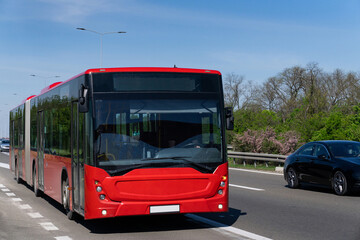 Red city bus on the highway