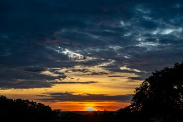Dramatic sunrise with intense natural orange lights and idyllic dramatic scenery