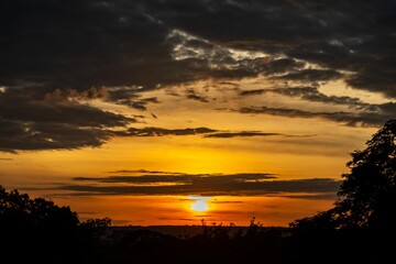 Dramatic sunrise with intense natural orange lights and idyllic dramatic scenery
