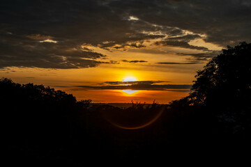 Dramatic sunrise with intense natural orange lights and idyllic dramatic scenery
