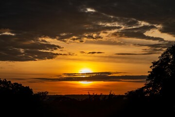 Dramatic sunrise with intense natural orange lights and idyllic dramatic scenery