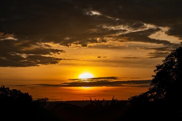 Dramatic sunrise with intense natural orange lights and idyllic dramatic scenery