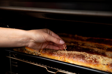 Baking Delicious Bread in the Oven with a Testing Tool to Achieve the Perfect Texture