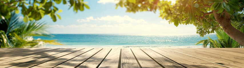 Fototapeta premium Tranquil tropical beach view from a wooden deck shaded by lush green foliage