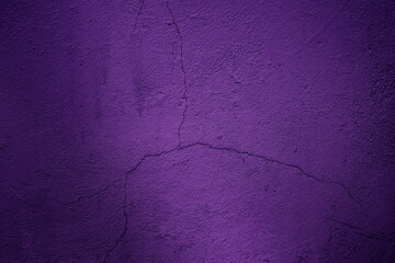 Cracked violet cement or concrete surface texture for background.