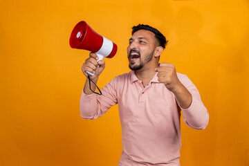 Overexcited Indian man with megaphone cheering on isolated background