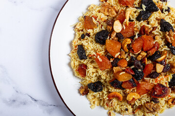 rice dish with dried fruits, nuts and spices of Middle Eastern cuisine, homemade, no people,