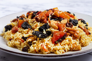 rice dish with dried fruits, nuts and spices of Middle Eastern cuisine, homemade, no people,