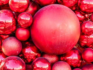 various outdoor red Xmas balls close up