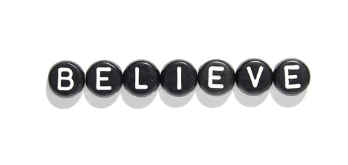 Believe conceptual word arrangement with black beads and white letters isolated on white background