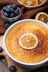 Tasty semolina cake served on wooden table, closeup