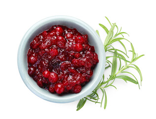 Tasty cranberry sauce in bowl and rosemary isolated on white, top view
