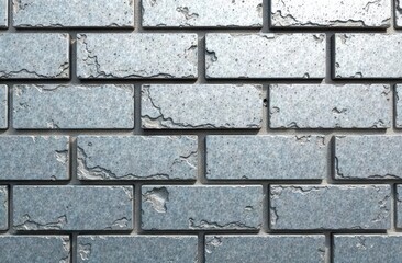 Obraz premium A modern brick surface with a polished finish, each brick engraved with unique patterns and geometric shapes