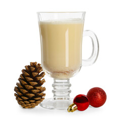 Tasty Christmas cocktail (eggnog) in glass, pine cone and baubles isolated on white