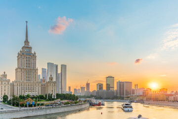 High-rise stalinist building near river at summer sunset in Moscow, Russia. Historic name is Hotel...
