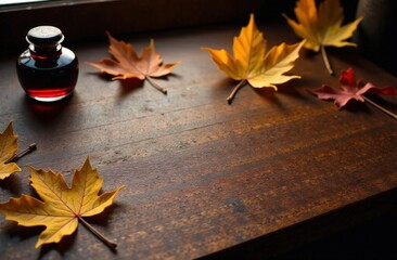 Obraz premium Mahogany Desk with Golden Leaves and Vintage Ink Bottle