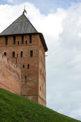 Fototapeta premium The Kremlin of Veliky Novgorod on a green field