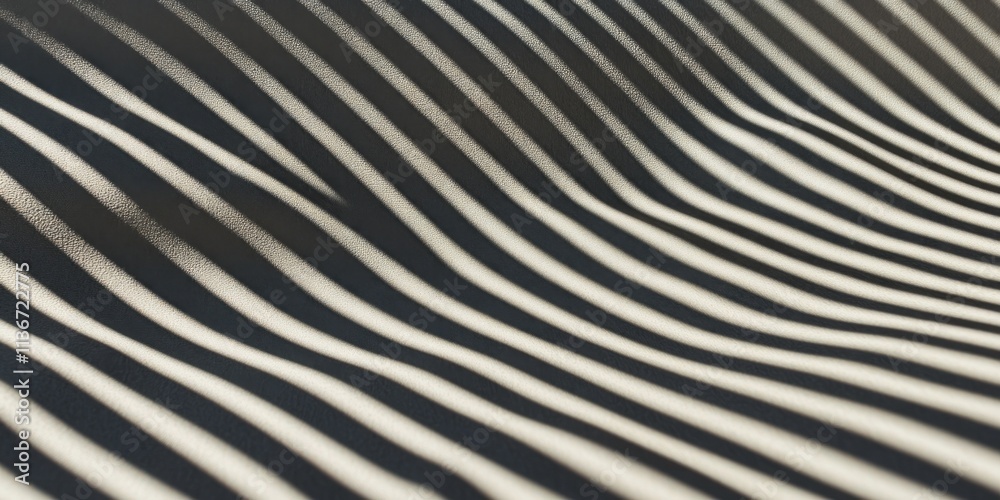 Aufkleber Shadows of waves create a captivating texture on a surface showcasing movement and depth in soft lighting