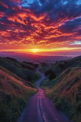 Fototapeta premium Majestic sunset over winding road in a picturesque landscape