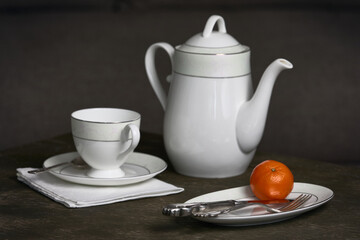 Still life with white ceramic tea set.