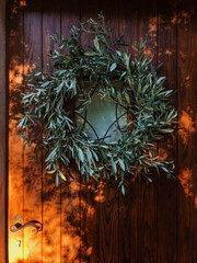 Sardinian Wooden Door with Olive Branch Wreath in Olbia, Italy