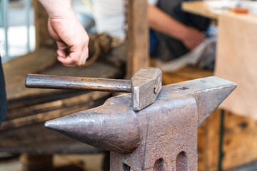 Old Anvil with Hammer in the Blacksmith Shop