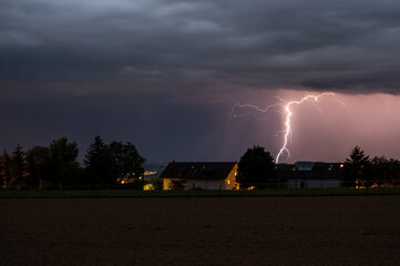 Storm, lightning strike on house.