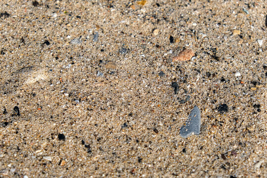 Sand mixed with pebbles background