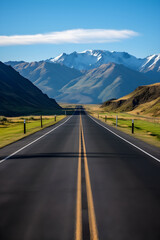 Naklejka premium Open Road Adventure: An Inviting Asphalt Road to The Horizon Between Mountains and Blue Sky