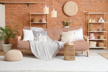 Interior of living room with couch, table and shelf units
