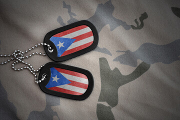 army blank, dog tag with national flag of puerto rico on the khaki texture background. military...