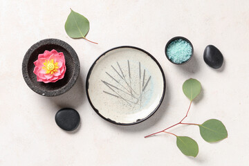 Plakat Acupuncture needles, sea salt, flower and spa stones on light background