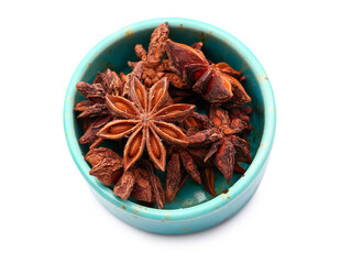 Bowl with aromatic star anise on white background