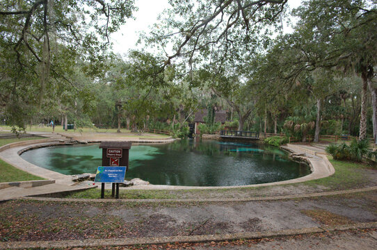 Editorial Use Only November 11, 2023 Wide view of Juniper Springs, FL USA Round sidewalk with reflections and trees.