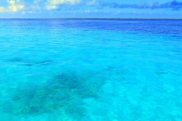 Azure blue ocean under the sunny day with blue sky. Tropical paradise calm sea. 