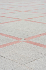 Top view of surface covered in outdoor red and white tiles 